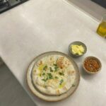 Flatbread cooking in an air fryer until puffed with golden brown spots