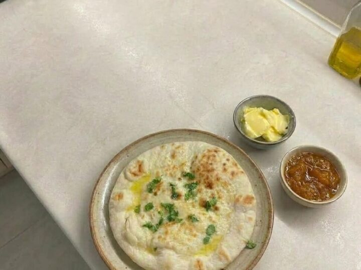 Flatbread cooking in an air fryer until puffed with golden brown spots