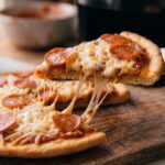 close up of golden crispy pizza crust from air fryer