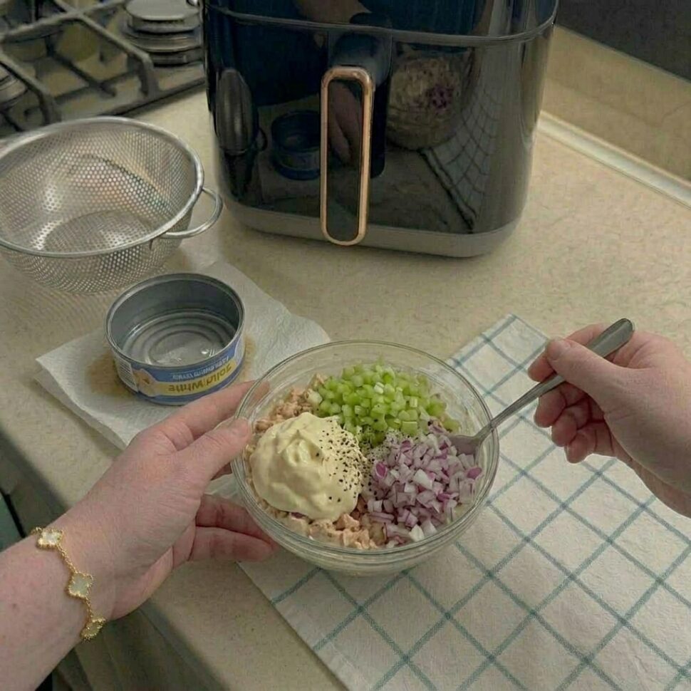 Flaked tuna mixed with mayonnaise celery red onion and pepper into a creamy filling