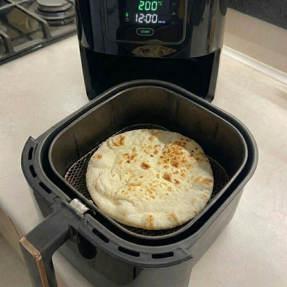Dough being kneaded on a floured surface until smooth and elastic