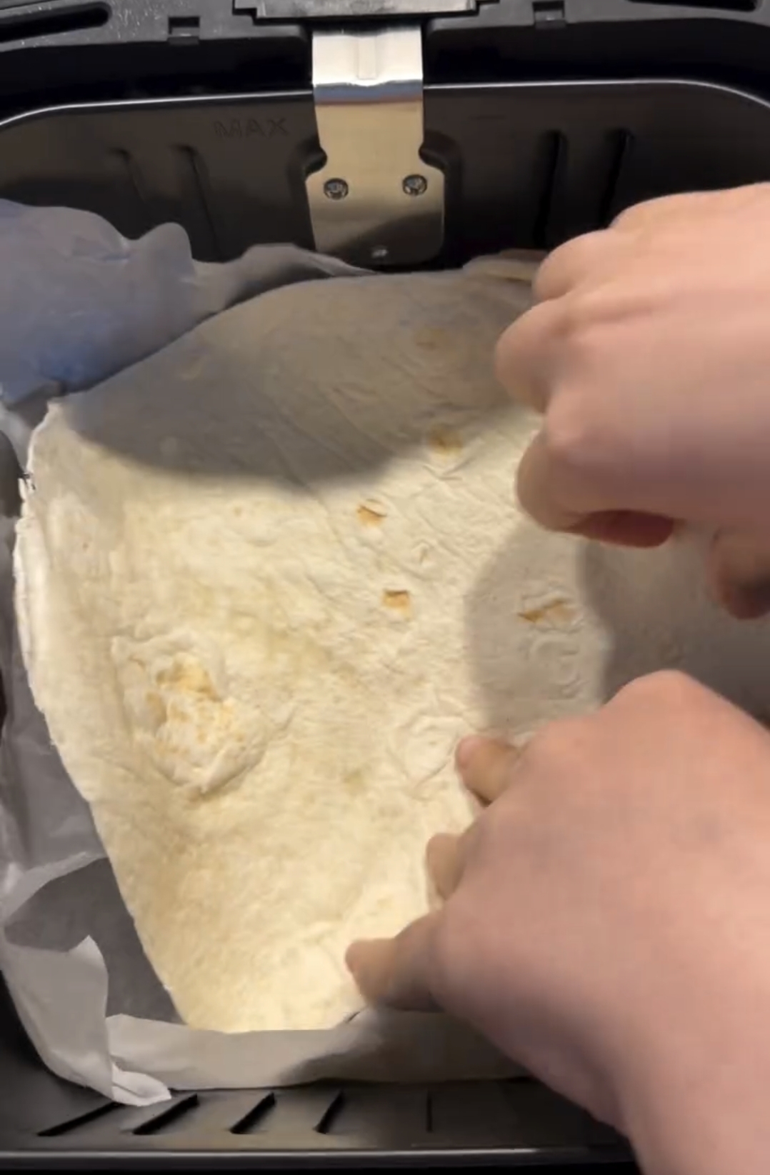 tortilla placed flat as base for air fryer omelette