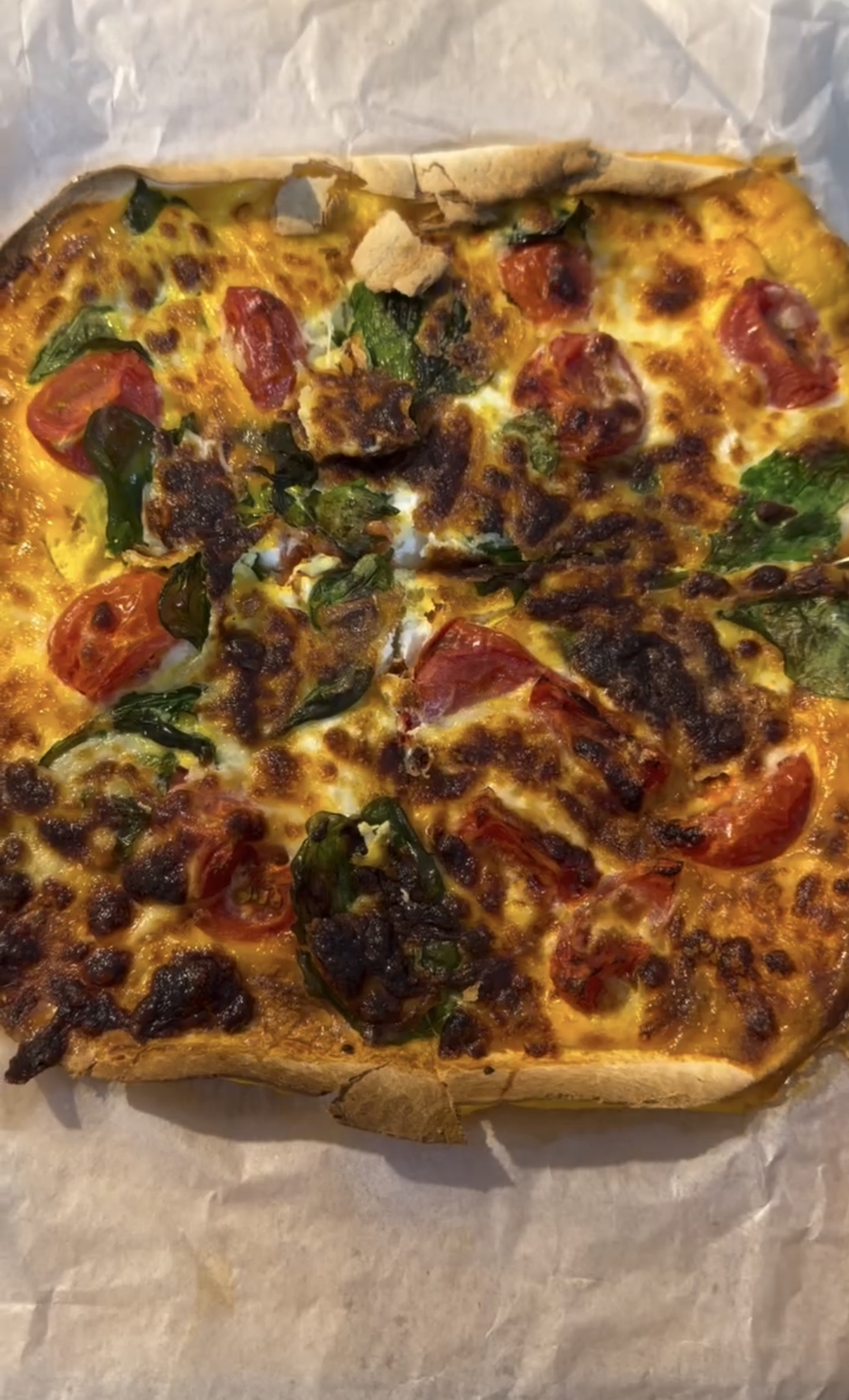 air fryer tortilla omelette served hot with melted cheese and fresh basil