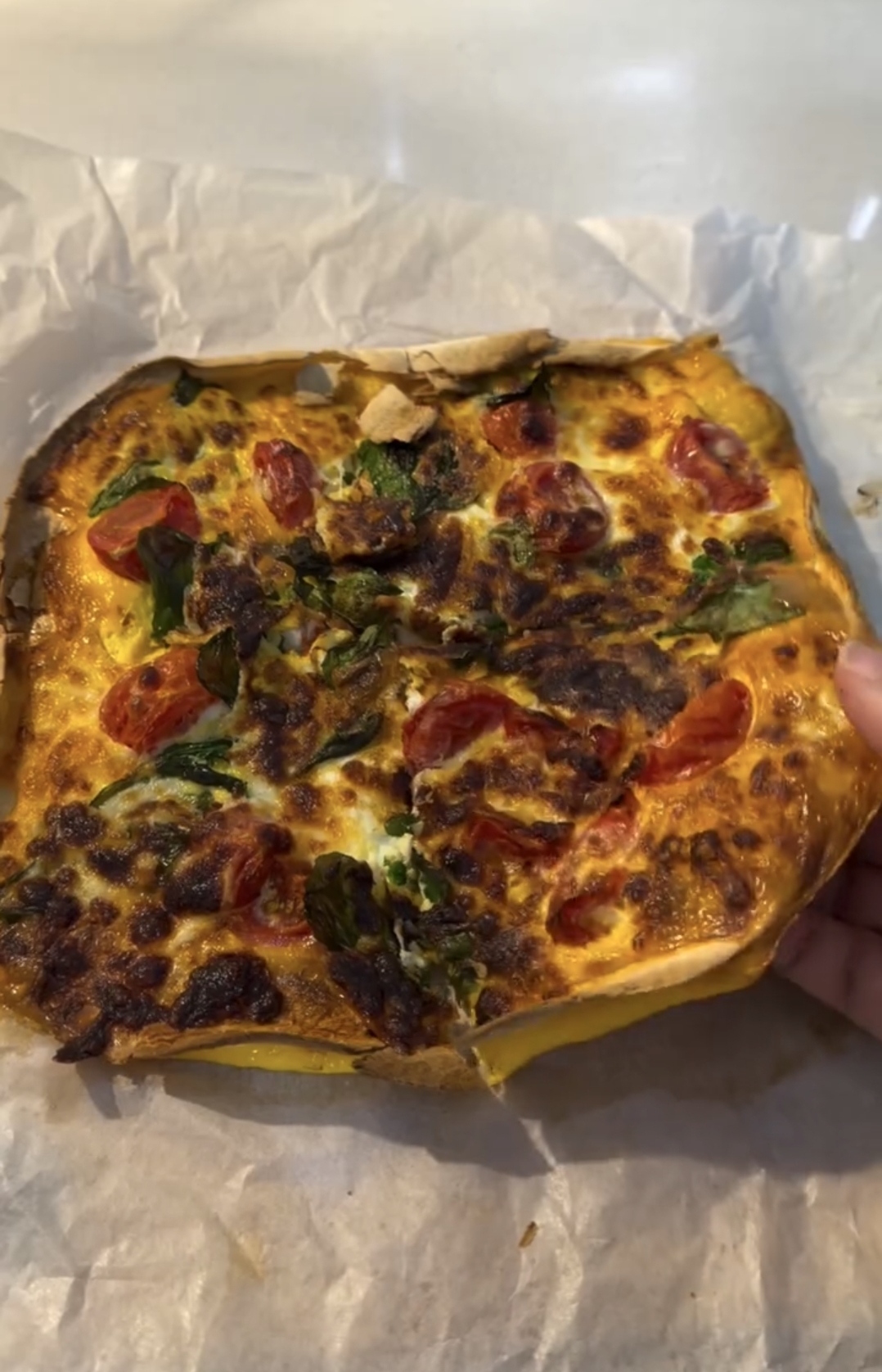 cooked air fryer tortilla omelette with crispy edges and melted cheese