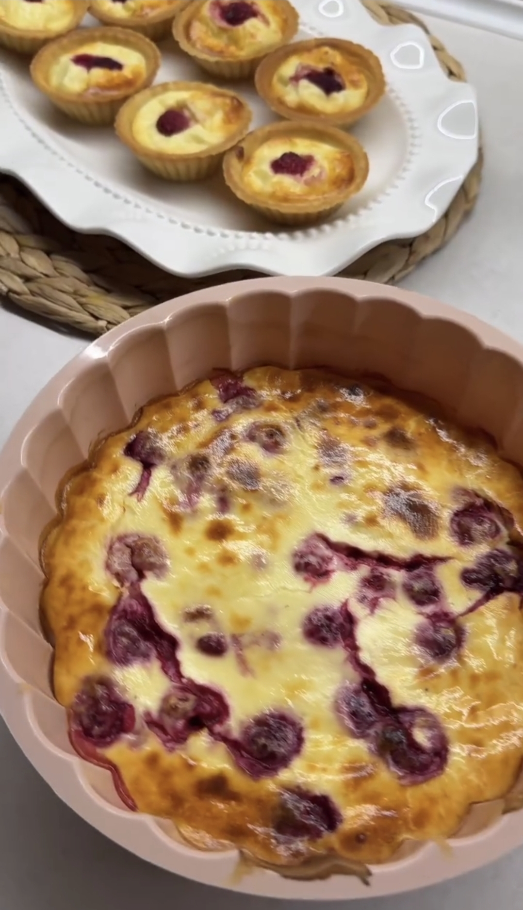 air fryer raspberry casserole baked in a pink mold and served on a white plate