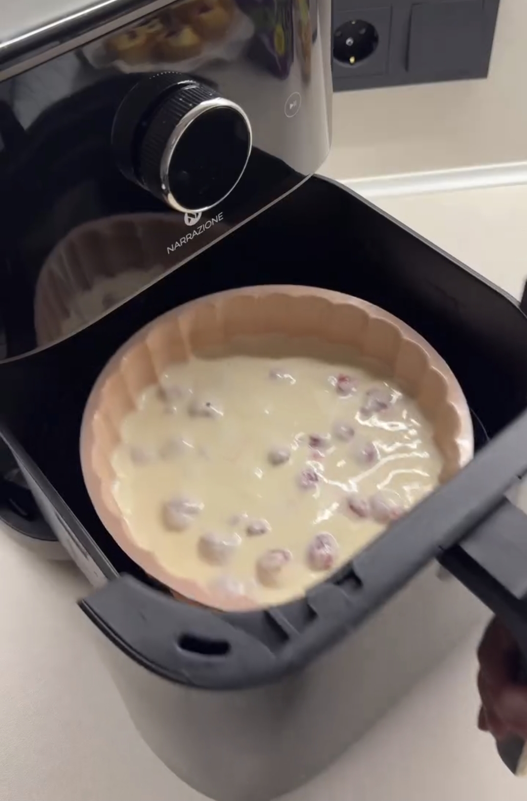 air fryer raspberry casserole ingredients whisked together in a white bowl