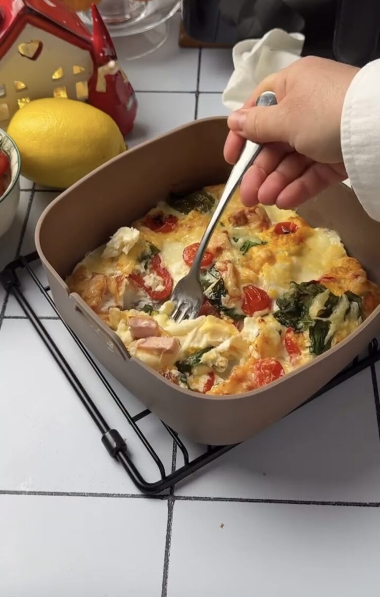 10-minute air fryer breakfast served on a wooden board with a side of toast