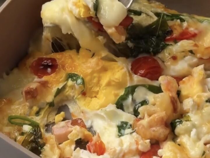 10-minute air fryer breakfast with white mozzarella rounds being placed on the egg base
