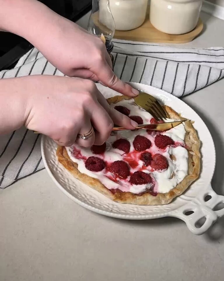 golden crispy roti tart with melted creamy cheese and juicy raspberries