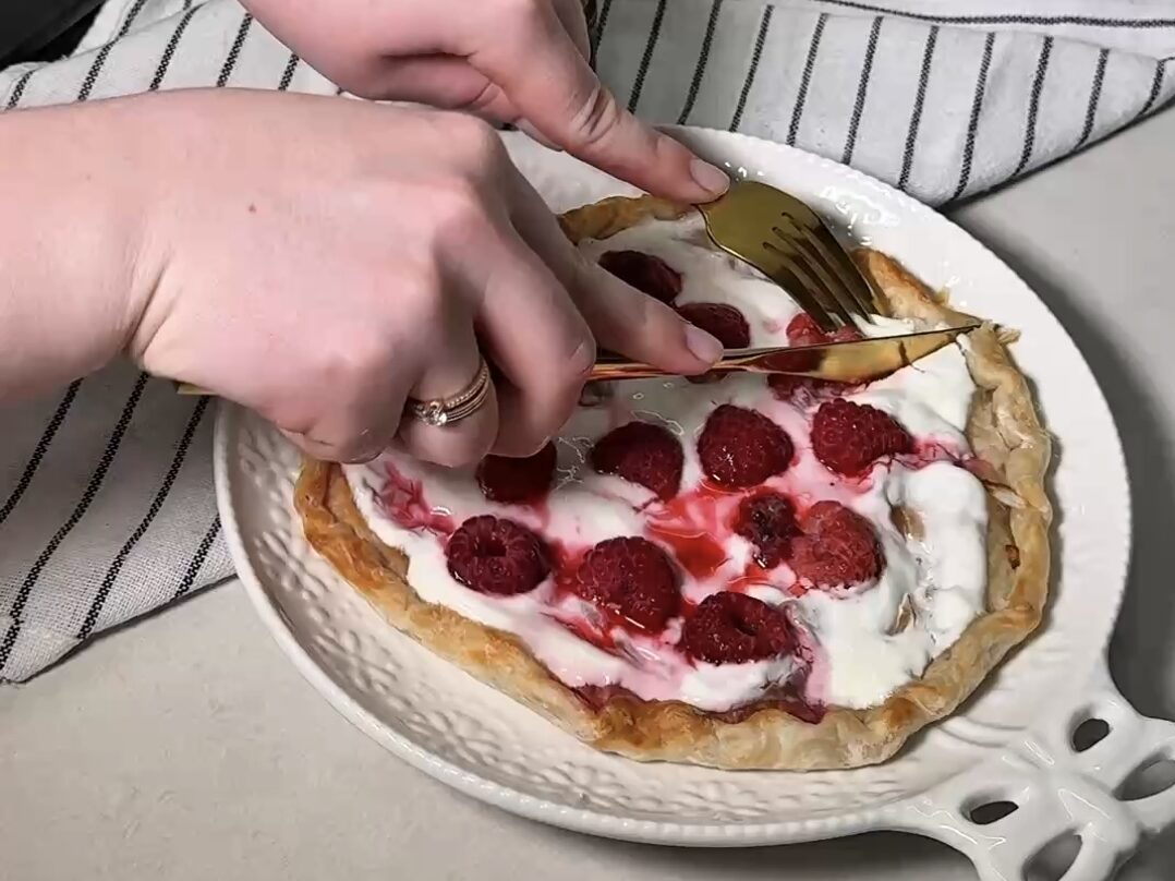 golden crispy roti tart with melted creamy cheese and juicy raspberries