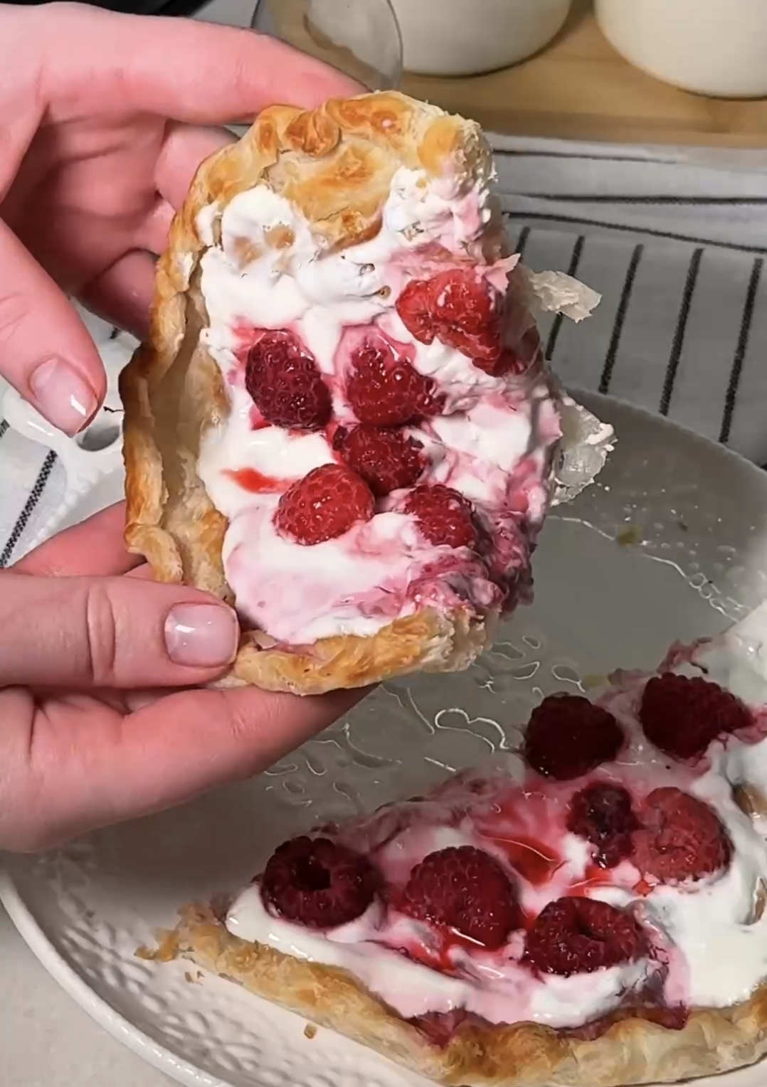 close up of creamy raspberry roti tart showing texture and juicy berries