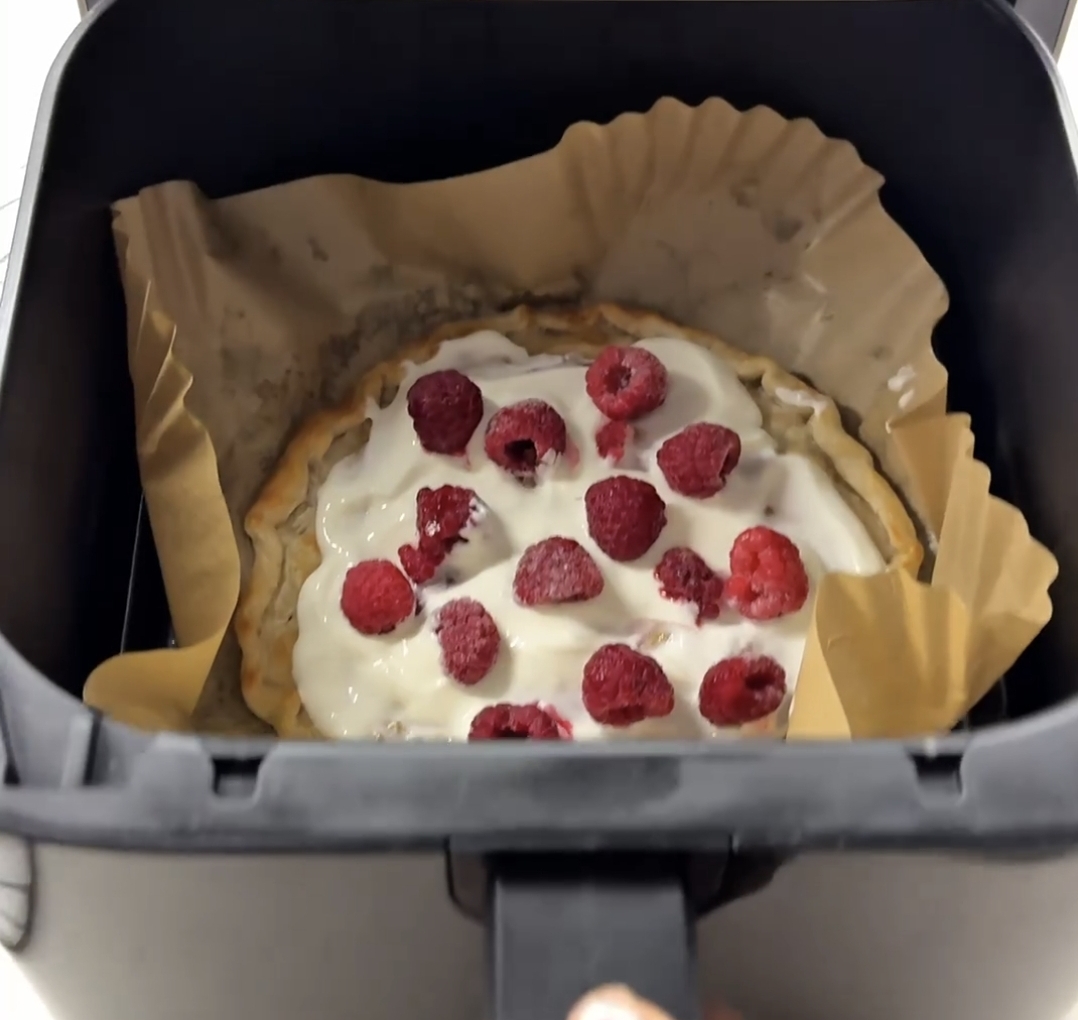 creamy cheese filling spread evenly on warm crispy roti base