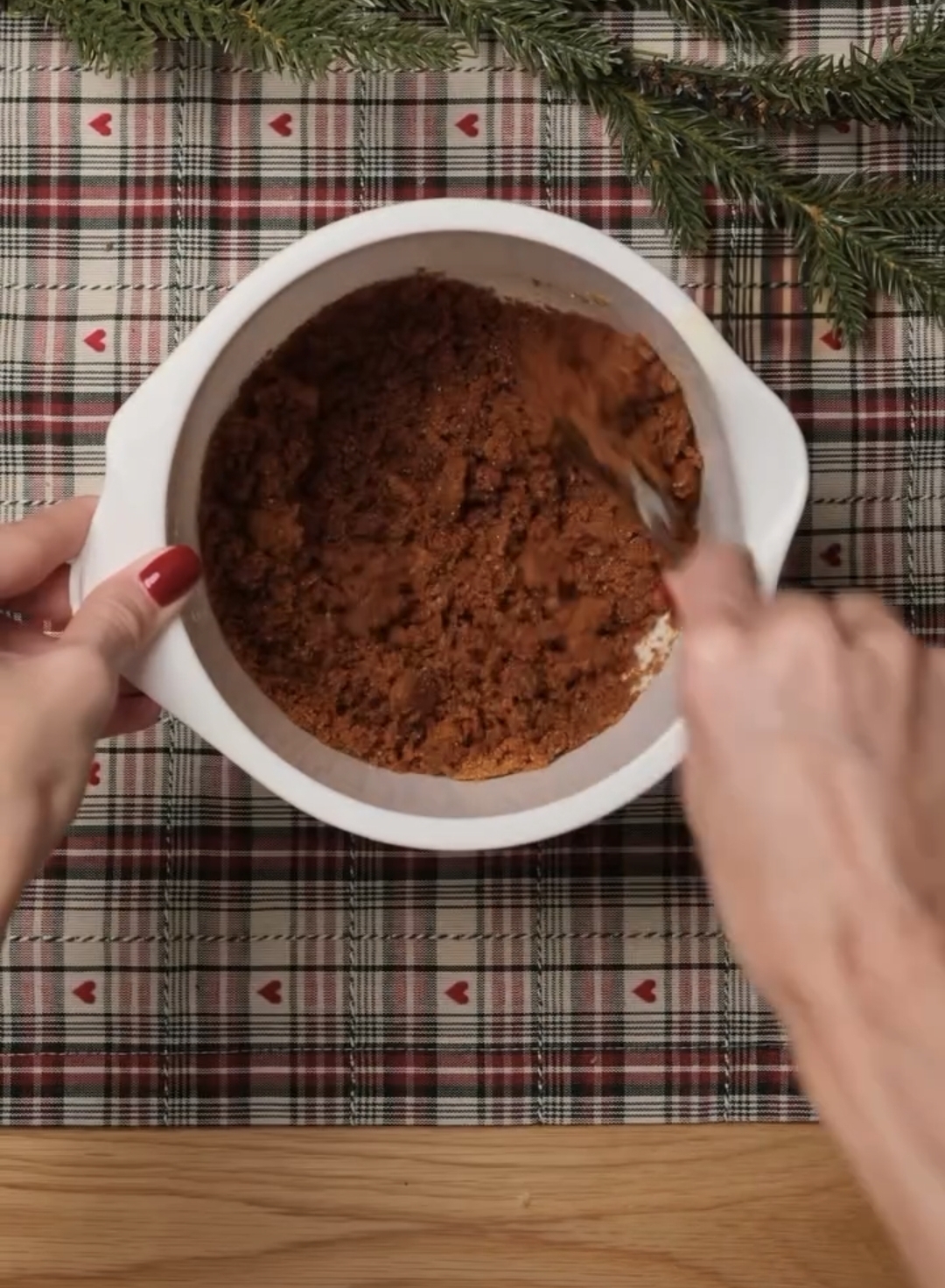 biscoff crumb mixture pressed firmly into cake pan to form base