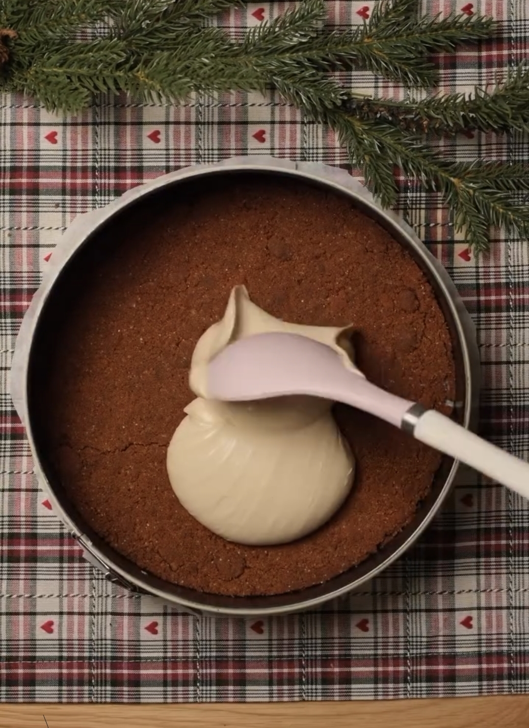 cheesecake batter poured over prepared biscoff crust evenly