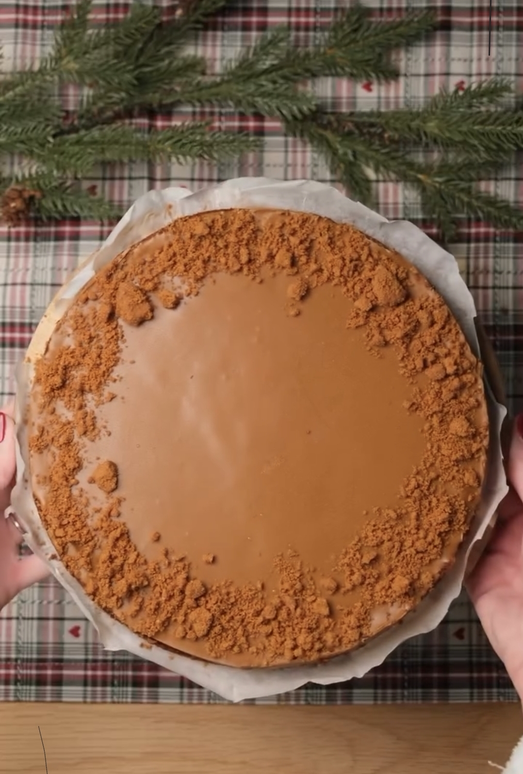 warm biscoff topping poured over chilled cheesecake surface