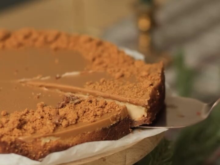 slice of creamy biscoff cheesecake showing smooth texture layers