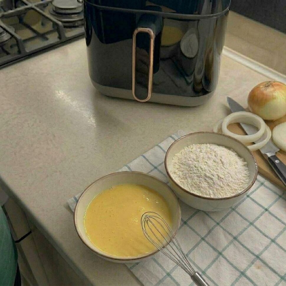 Yellow onions sliced into thick rings with layers separated into individual circles