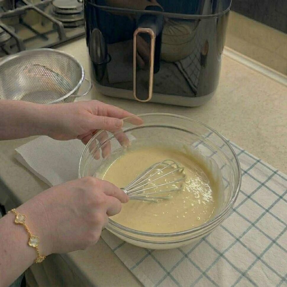 Warm milk yeast and sugar mixed until foamy in a glass bowl