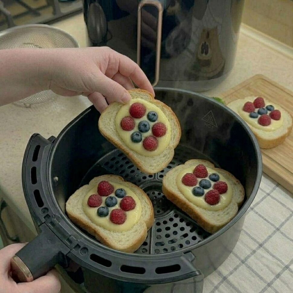 Custard mixture poured into the center of bread slices and topped with berries
