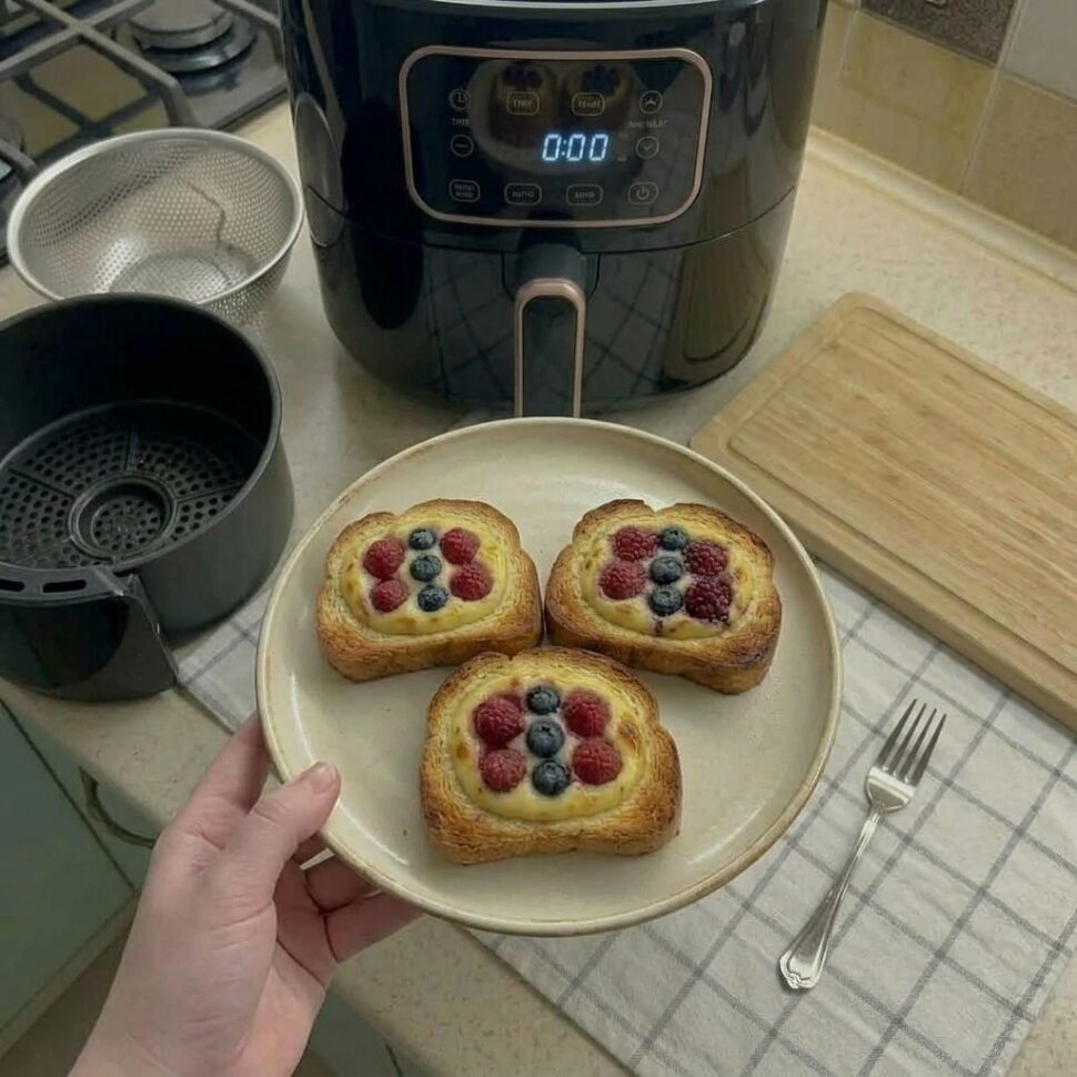 Custard mixture poured into the center of bread slices and topped with berries