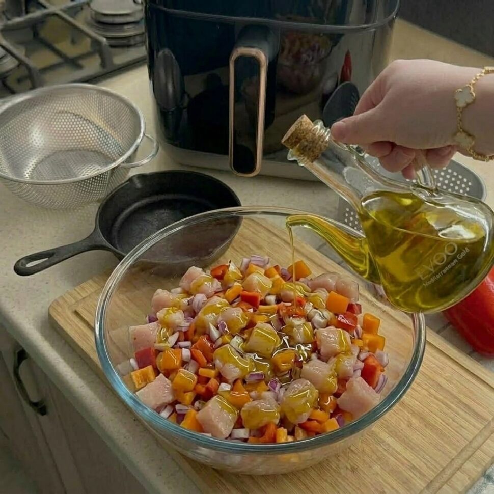 Meat mixture rolled into even round balls on a cutting board using lightly oiled hands