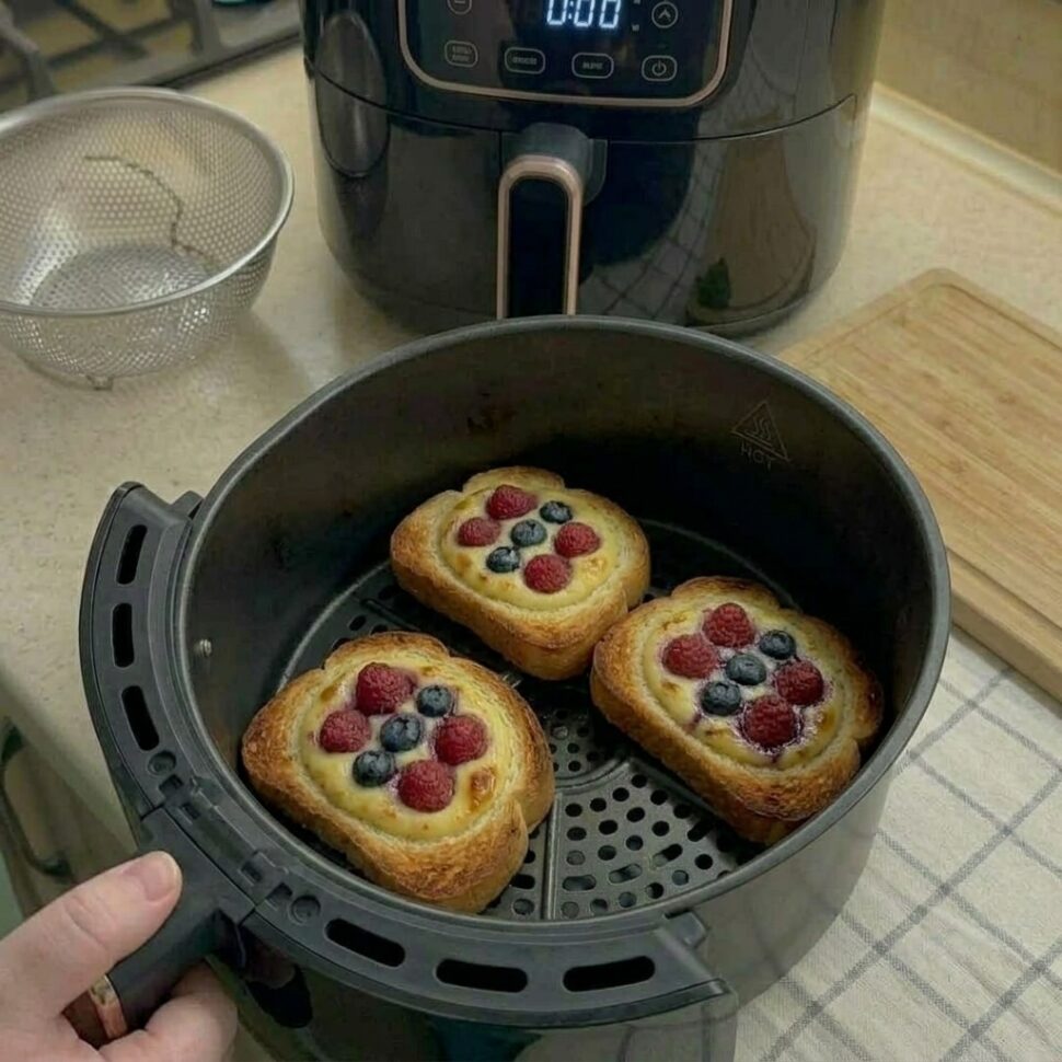 Golden yogurt toast served warm with creamy center and juicy berries on top